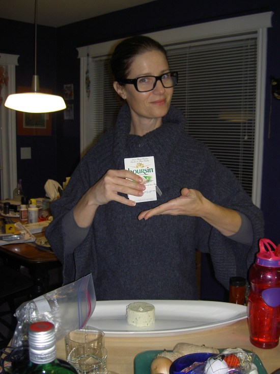 Janet poses proudly with her boursin cheese... stage one of her appy assemblage...